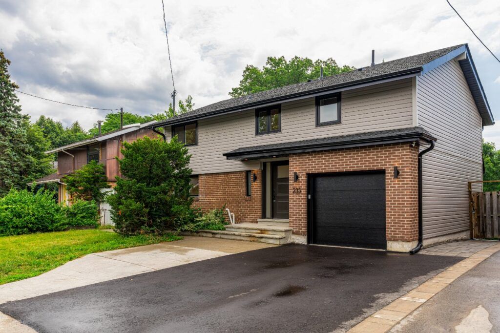 Exterior of a renovated Scarborough home with brick and grey siding